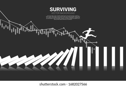 Silhouette of businessman jumping away on collapse domino. business concept of business disruption and domino effect 