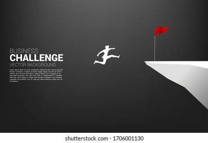 silhouette of businessman jumping to flag on cliff. Business Concept of targeting and customer.route to success.