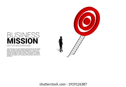 silhouette of businessman with ladder to target dartboard. Concept of vision mission and goal of business
