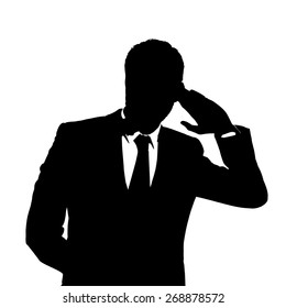 Silhouette of businessman listening something 