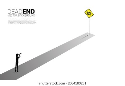 Silhouette of businessman look in telescope with dead end signage  . Concept of wrong decision in business or end of career path.