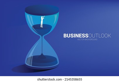 Silhouette of businessman look in telescope standing with sand clock. Concept for business vision and outlook time.