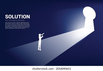 Silhouette of businessman looking through telescope looking to key hole exit. Find the solution concept vision mission and goal of business