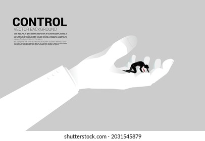 silhouette of businessman on knee in big hand. Concept for work life in control.