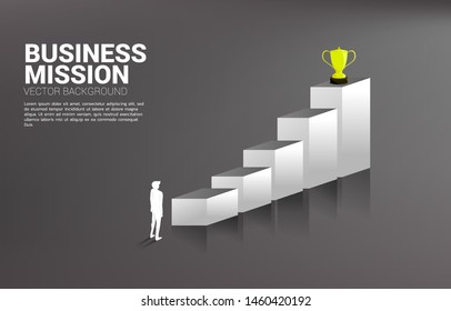 Silhouette businessman planning to get trophy on top of graph. Business Concept of  goal and vision mission