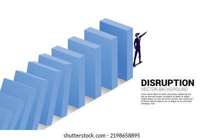 Silhouette of businessman point forward at the end of domino collapse. Concept of business industry disrupt