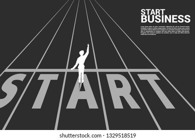 Silhouette of businessman point up to the start line on track. business concept for start up business.