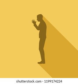 Silhouette of businessman in prayer pose. Web icon with long shadows for application