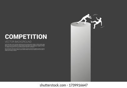 silhouette of businessman push the other falling down from the tower. Concept for business competition and challenger.