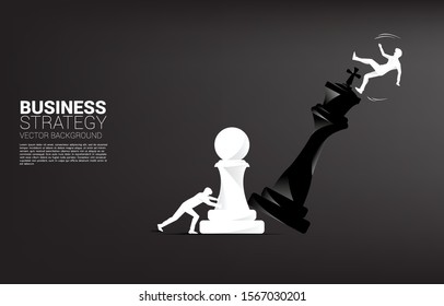 Silhouette of businessman push pawn chess piece to checkmate the king with falling down businessman. concept of business strategy and marketing plan disruption