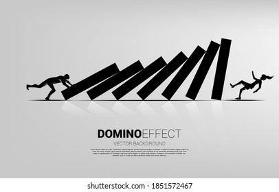 Silhouette of businessman pushing to collapse domino to businesswoman falling down. business concept of business disruption and domino effect