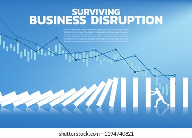 Silhouette of businessman pushing for stop falling of domino. business concept of try to stop the domino effect 