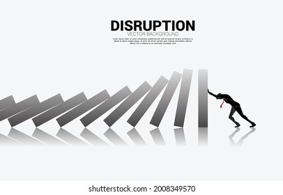 Silhouette of businessman pushing for stop falling of domino. business concept of try to stop the domino effect 