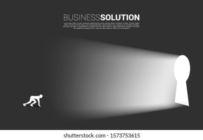 silhouette of businessman ready to run out to key hole door. Find the solution concept vision mission and goal of business