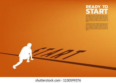Silhouette of businessman ready to run from start line. Concept of people ready to start career and business