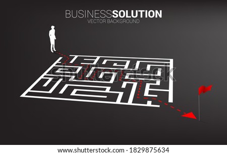 Silhouette of businessman with route path to exit  the maze. Business concept for problem solving and finding idea.
