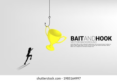 Silhouette of businessman running with fishing hook with trophy. Concept of bait and hook in business rewards..