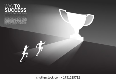 Silhouette businessman running in light from exit door shape trophy. Business Concept of route to winner and champion