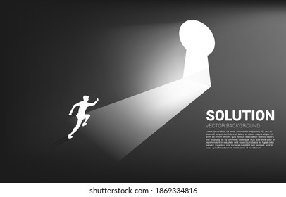 silhouette of businessman running to move out to key hole door. Find the solution concept vision mission and goal of business