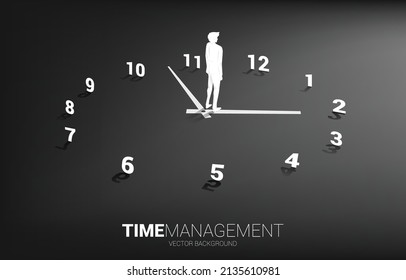 Silhouette of businessman standing with clock. Concept for office employee and working time.