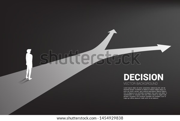 Silhouette of businessman standing at crossroad. Concept of time to make decision in business direction
