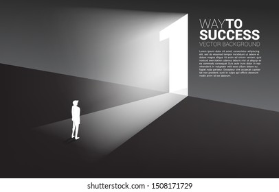 Silhouette of businessman standing in front of exit door number one. Concept of career start up and champion business solution.