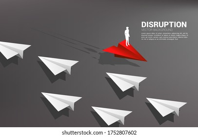 Silhouette of businessman standing on red origami paper airplane go different way from group of white. Business Concept of disruption and vision mission.