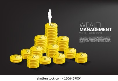 Silhouette of businessman standing on top of stack of coin. Concept of success investment and growth in business
