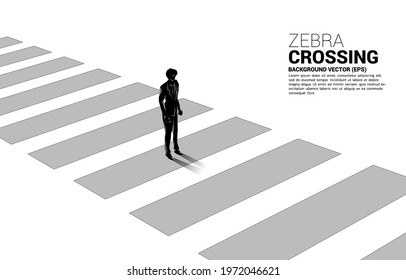 Silhouette of businessman standing on zebra crossing. Concept of safe zone and business road map.