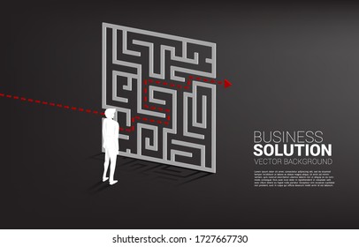 Silhouette of Businessman standing with plan to exit from maze . Business concept for problem solving and solution strategy