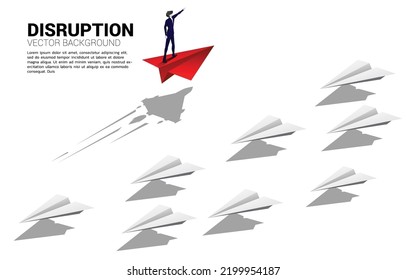 Silhouette of businessman standing and point forward on red origami paper airplane go different way from group of white. Business Concept of disruption and vision mission.