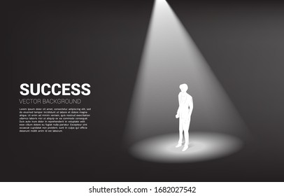 Silhouette of businessman standing in spotlight. business concept of mission vision and leadership