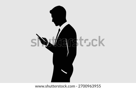 Silhouette of Businessman Using Smartphone