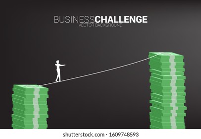 Silhouette of businessman walking on rope walk way to higher banknote stack .Concept for business risk and career path