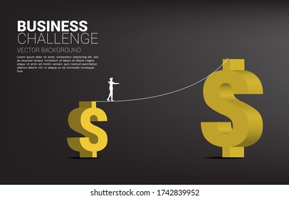 Silhouette of businessman walking on rope walk way to bigger money dollar icon.Concept for business risk and challenge.