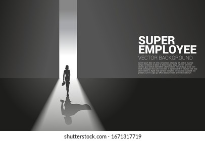 Silhouette of businesswoman and her shadow of superhero from light of exit way.concept of empower potential and human resource management