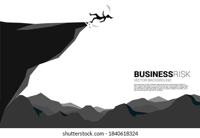 silhouette of businesswoman slip and falling down from the cliff. Concept for fail and accidental business