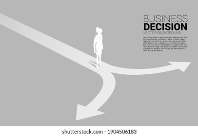 Silhouette of businesswoman standing at crossroad. Concept of time to make decision in business direction