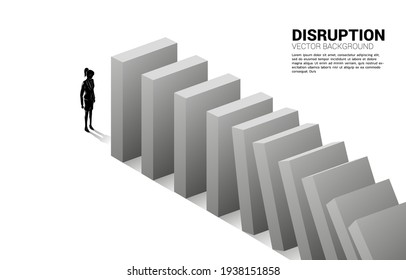 Silhouette of businesswoman standing at the end of domino collapse. Concept of business industry disrupt 