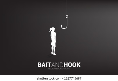 Silhouette of businesswoman standing with fishing hook. Concept of bait and hook in business. 