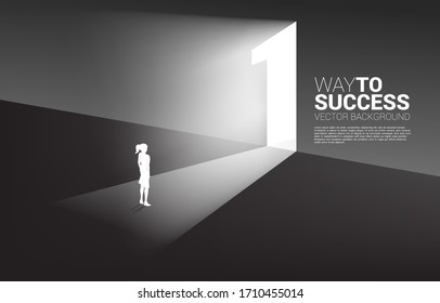 Silhouette of businesswoman standing in front of exit door number one. Concept of career start up and champion business solution.