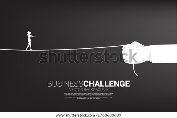 silhouette of\
businesswoman walk rope in businesswoman hand. Concept of Business\
challenge and career\
path.
