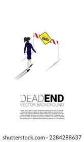 Silhouette businesswoman walking to dead end signage  . Concept of wrong decision in business or end of career path.