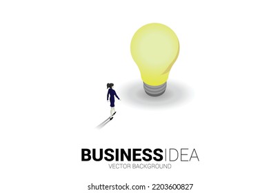 Silhouette of businesswoman walking to light bulb . Business Concept of creative idea and solution.