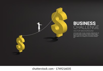 Silhouette of businesswoman walking on rope walk way to bigger money dollar icon.Concept for business risk and challenge.