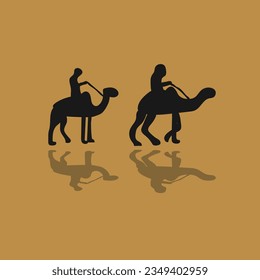 silhouette of a camel walking in the desert with a rider