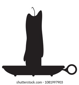 A silhouette of a candle on a holder isolated on a white background