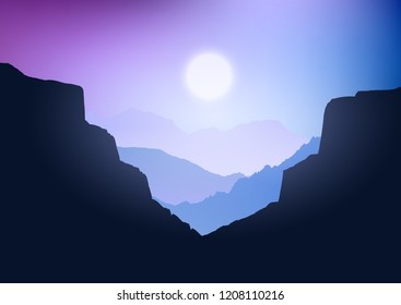 Silhouette of a canyon landscape against a sunset sky
