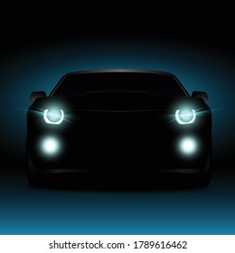 Silhouette of a car in the dark at night. Glowing car headlights and fog lights.