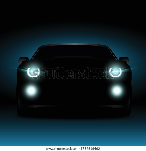 Silhouette of a car in the dark at night. Glowing\
car headlights and fog\
lights.